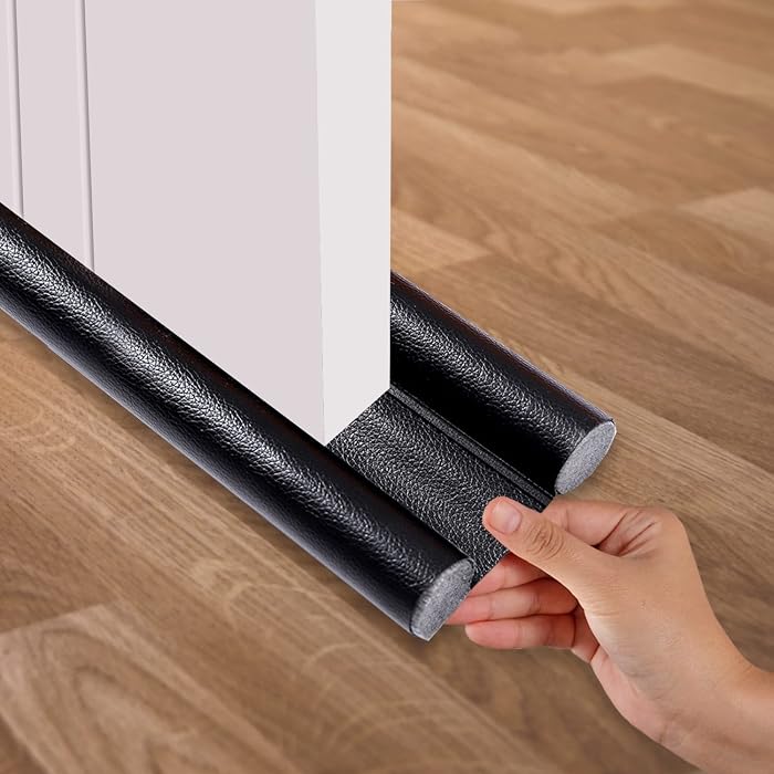 Door draft stopper sealing the gap under a front door in winter