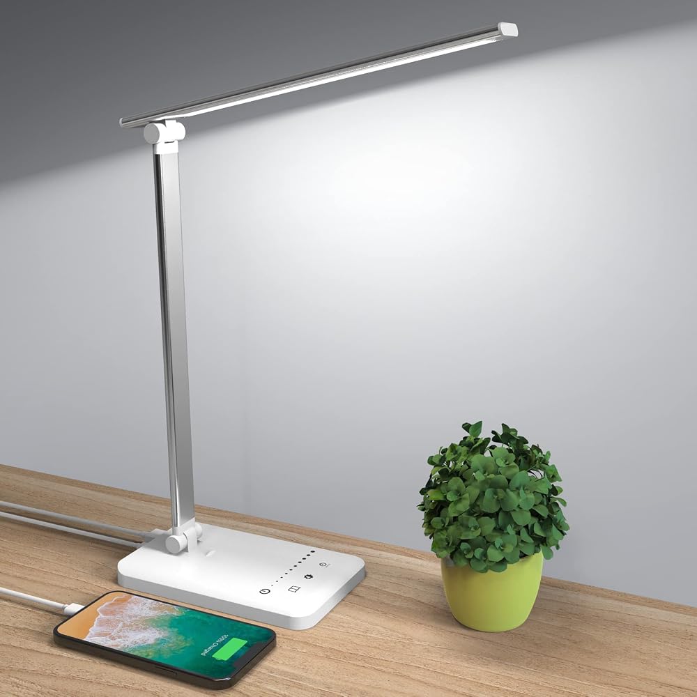 Modern LED desk lamp with USB charging port on a home office desk