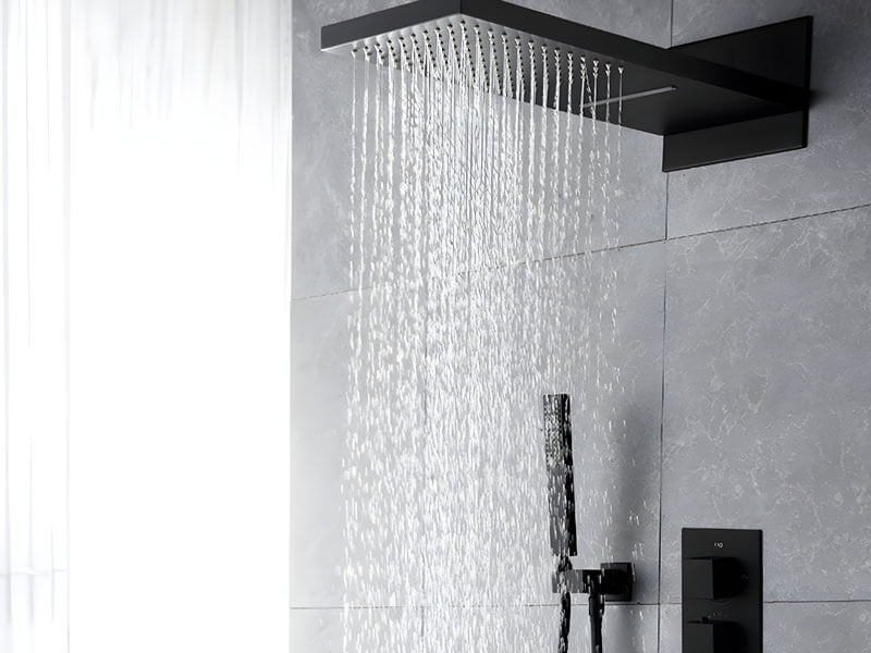 Rainfall shower head streaming water in a modern bathroom