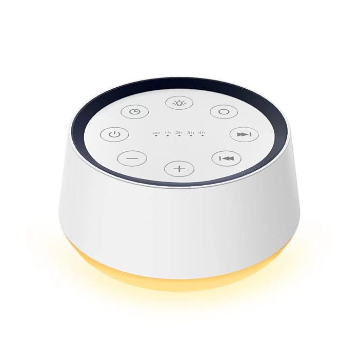 White noise sleep sound machine on a bedside table at night